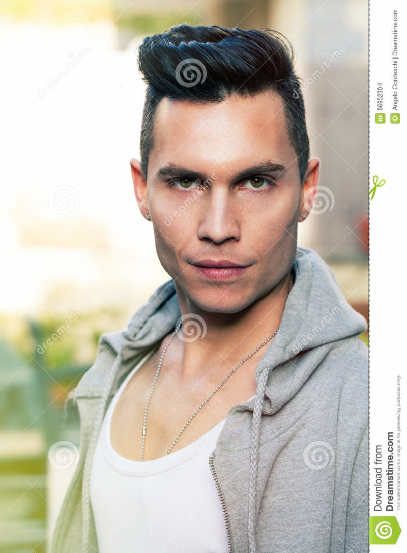 Cool look portrait modern young man, stylish hair cut Portrait of a beautiful boy with modern haircut. Straight hair. Outdoors, intense look. light colors, high-definition pictures rich in detail.