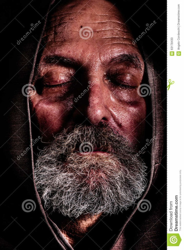 Homeless, a Capuchin friar. Bum poverty and suffering Homeless, a Capuchin friar. Bum poverty and suffering. Close portrait of an elderly man with eyes closed and with a hood over his head. Concept of abandonment, suffering, and aging. Effect high definition range, dragan.