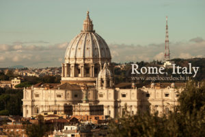Fabulous photograph of the dome of St. Peter's Basilica in Rome in Italy. Photo taken with ultra-telephoto lens from the Gianicolo Terrace. Antiqued colors. Sunset lights.