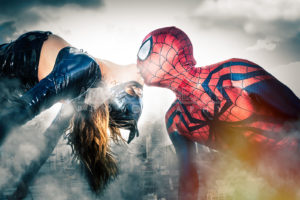 Spider-Man and Catwoman kissing. Comic characters. Photography and post production done by me to sponsor the important ROMICS 2016 event in Rome, Italy. New york city in the clouds.