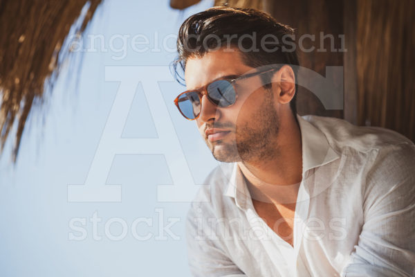 Young And Handsome Man With Sunglasses Looking