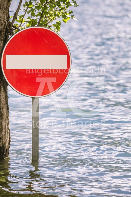 Access Prohibition Road Sign Partially Submerged In A Flood. Red Angelo Cordeschi