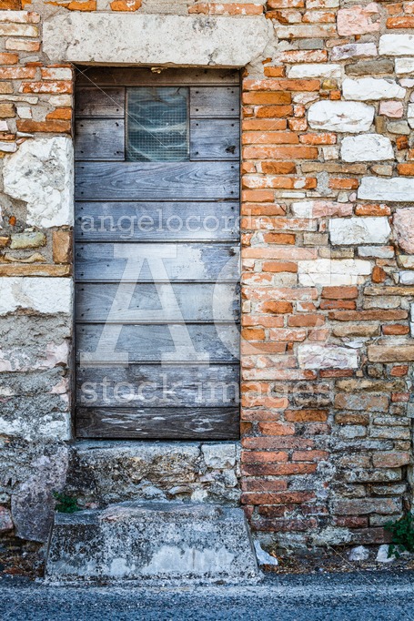 Ancient Wooden Door In An Old Historic Building. Assisi, Italy. Angelo Cordeschi