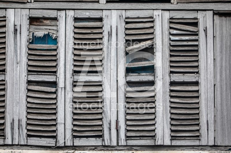Antique Windows, Worn Out By The Weather. Gray Wooden Shutters. Angelo Cordeschi