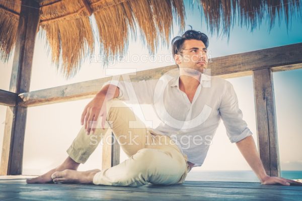 Beautiful Young Relaxed Man In A Small Wooden Deck Angelo Cordeschi