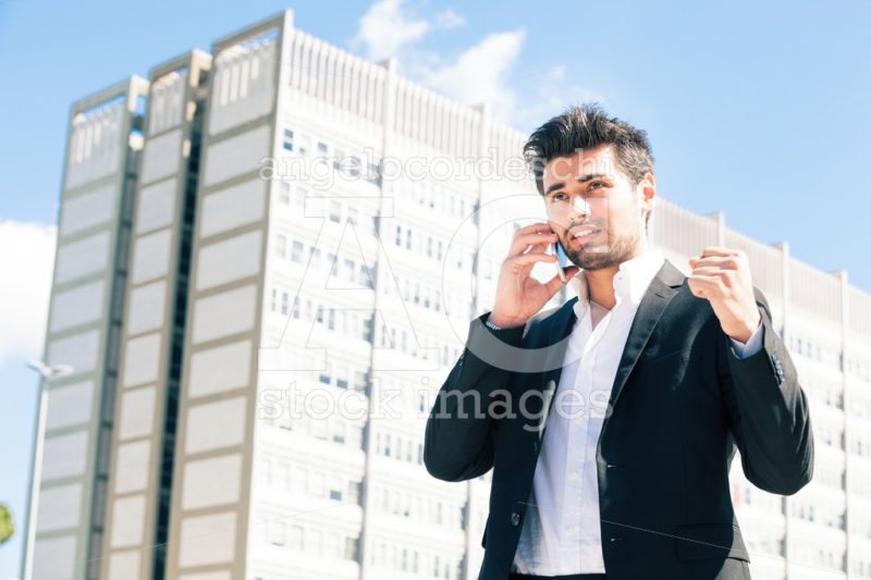 Business man talking on the phone with fist. Outdoor. - Angelo Cordeschi