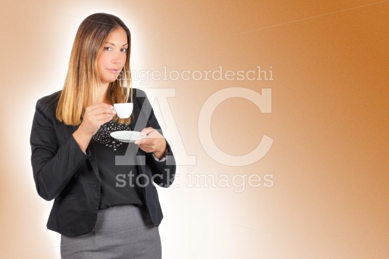 Business woman drinking coffee in cup. Work pause. - Angelo Cordeschi