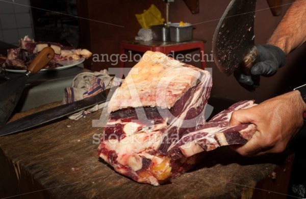 Butcher's Shop. Italian Chianina Meat. Cut With A Knife. A Man I Angelo Cordeschi