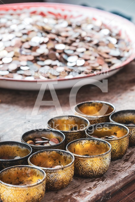 Coins As A Gift. Some Decorated Yellow Bowls Containing Coins Do Angelo Cordeschi