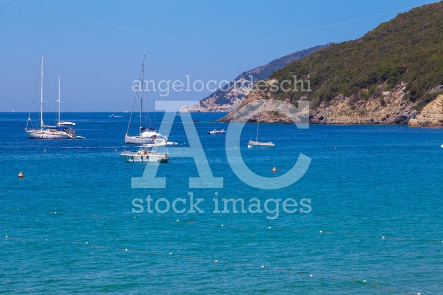 Elba Island, Italy. June 26, 2016: Blue Sea With Some Boats And Angelo Cordeschi