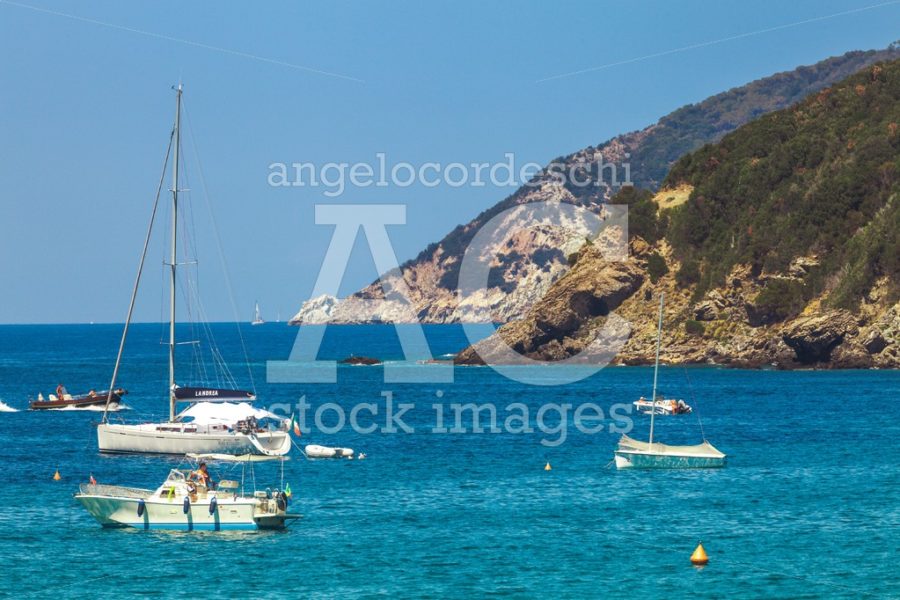 Elba Island, Italy. June 26, 2016: Blue Sea With Some Boats And Angelo Cordeschi