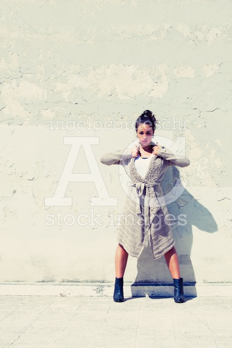 Fashion beautiful woman posing outdoor. Leg outstretched. Wool s - Angelo Cordeschi