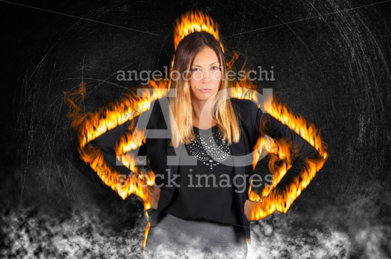 Female boss woman burning with rage. Very angry with fire flames. - Angelo Cordeschi