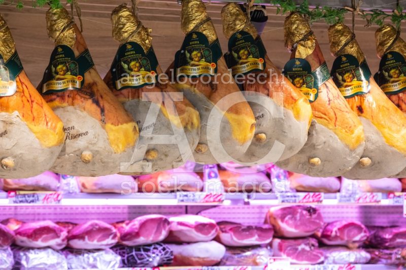 Gastronomy Department With Cold Cuts Prosciutto Ham Hanging. Angelo Cordeschi