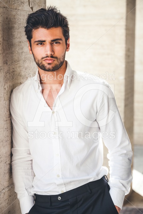 Handsome and stylish young man with white shirt. Stubble beard. - Angelo Cordeschi