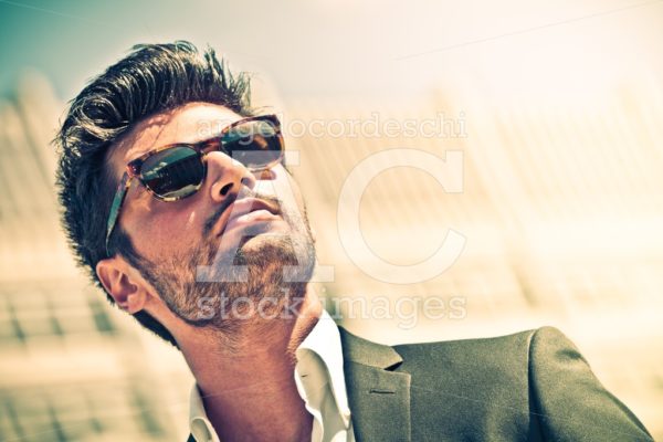 Handsome businessman with sunglasses, outdoor in the city. Inten - Angelo Cordeschi