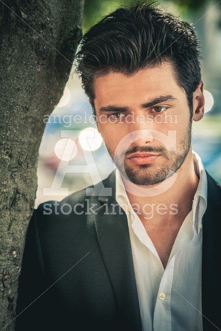 Handsome pensive man, portrait of young man with stubble beard. - Angelo Cordeschi