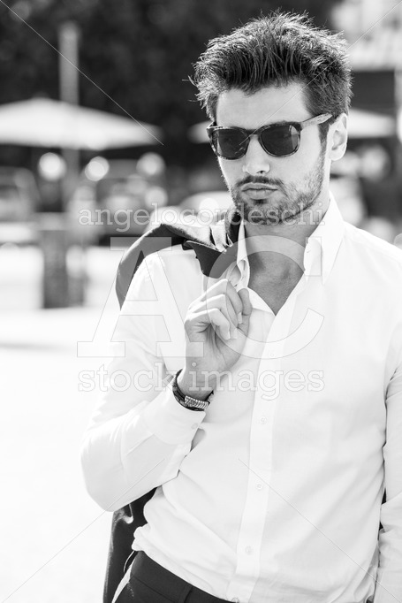 Handsome sexy man outdoors. Elegant and sensual. Sunglasses. - Angelo Cordeschi