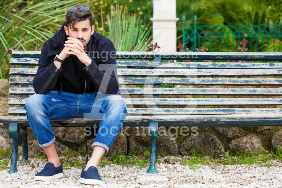 Handsome Young Man Model Sitting On The Bench. A Handsome Young Angelo Cordeschi