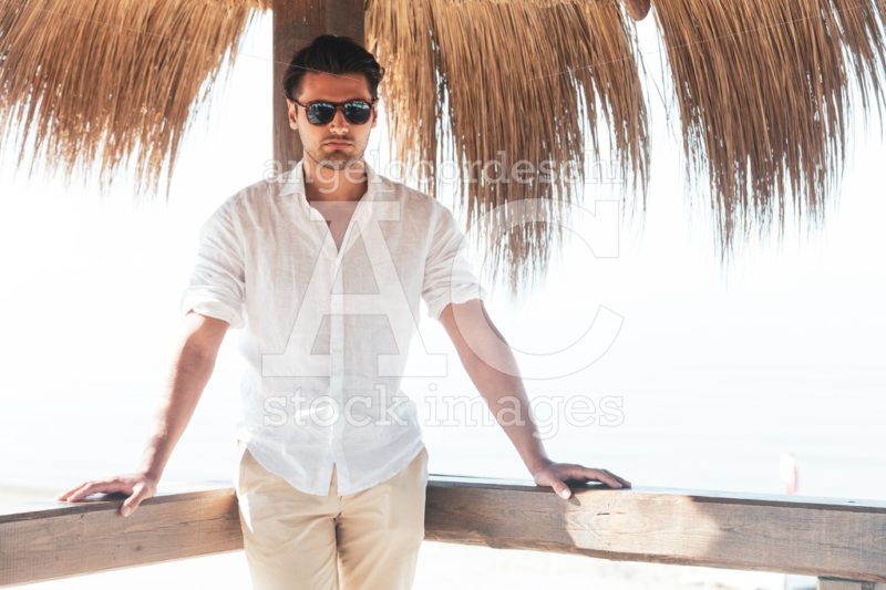 Handsome Young Man Outdoor With White Shirt And Sunglasses Relax Angelo Cordeschi