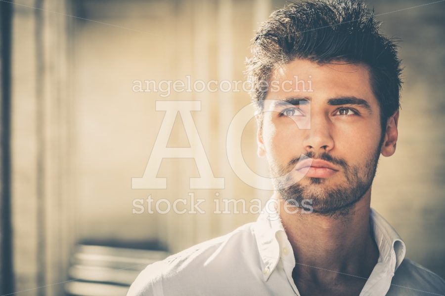 Handsome Young Man Portrait. Stubble Beard And Modern Hairstyle. Angelo Cordeschi