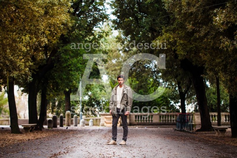 Handsome young man standing on a natural park. Winter autumn sce - Angelo Cordeschi