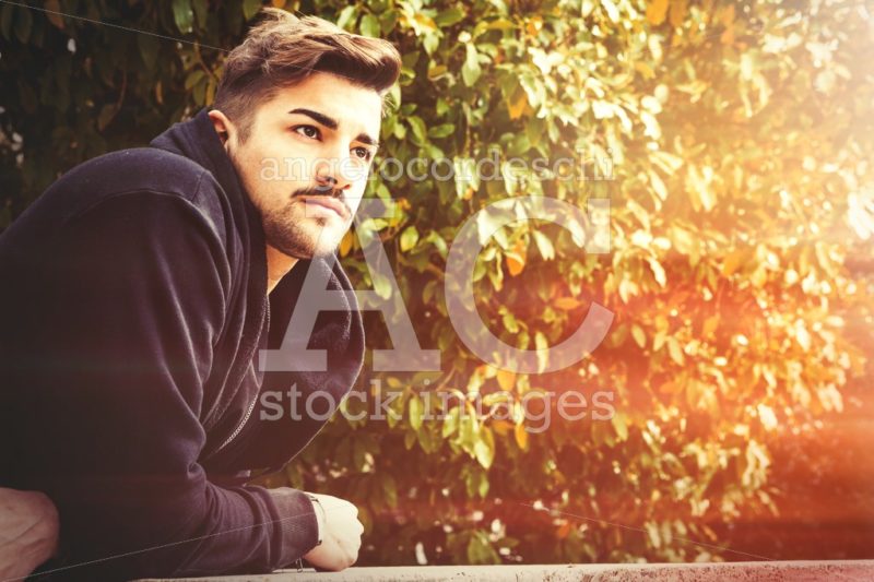 Handsome Young Man Waiting For In A Park With Trees And Leaves I Angelo Cordeschi