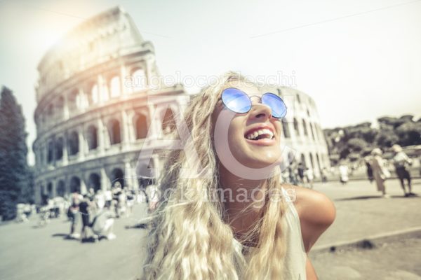 Happy Holidays In Rome, Smiling Young Blonde In Front Of Colosse Angelo Cordeschi