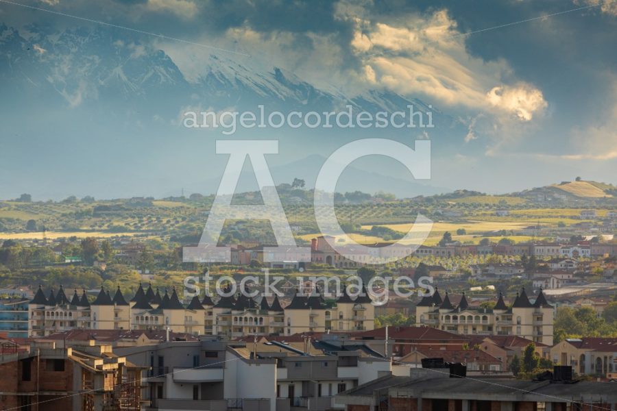 Idyllic Hilly Landscape With Houses And Cloudy Sky Over Sunset. Angelo Cordeschi
