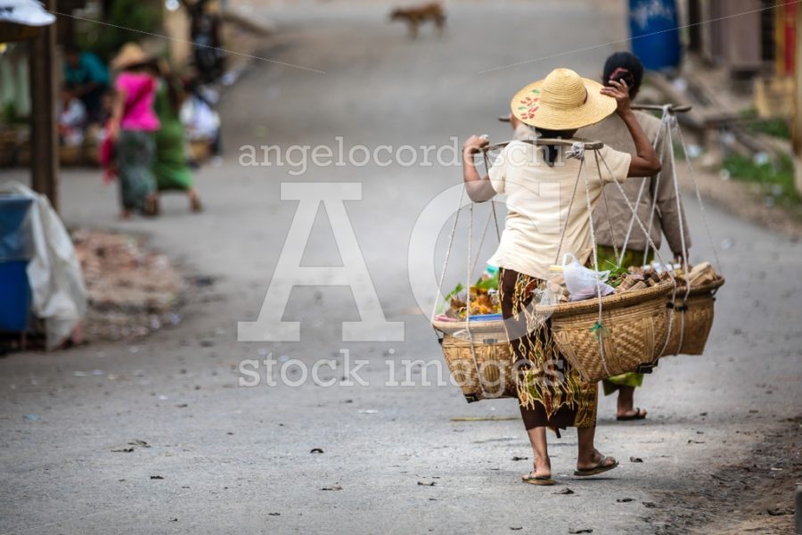 Indigenous Woman From A Myanmar Village Carrying Food With A Lon Angelo Cordeschi