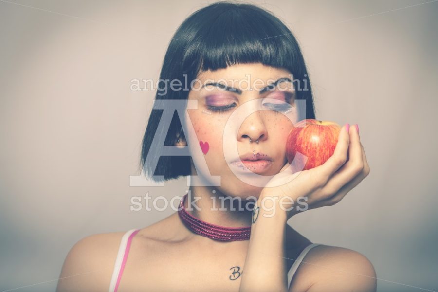 Loving nature. Young woman with apple. Young and beautiful girl - Angelo Cordeschi