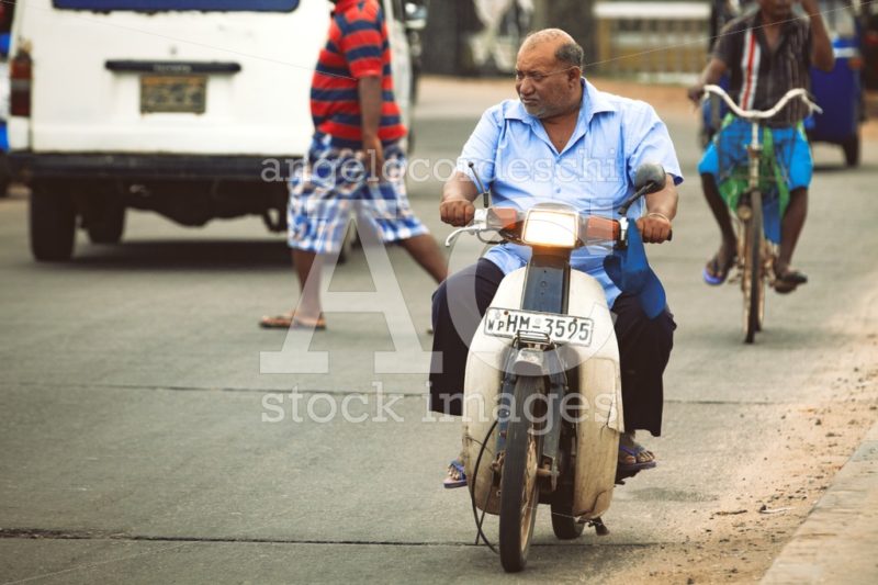 Man On Scooter Motorcycle In The Street. City Of Negombo In Sri Angelo Cordeschi