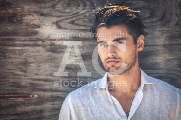 Man Portrait, Young And Handsome Man On Wooden Background. He Is Angelo Cordeschi