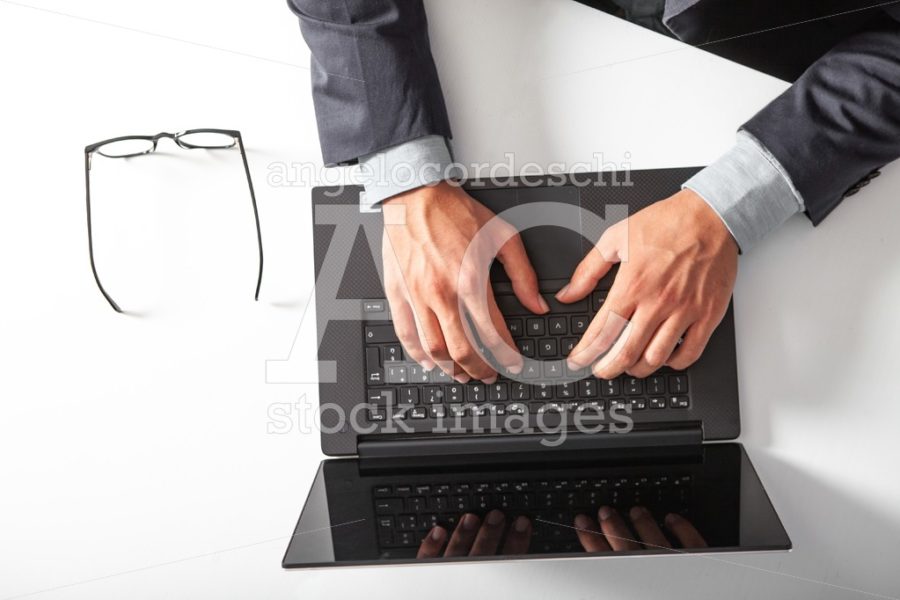 Man With Laptop Typing On The Keyboard. Black Screen. Angelo Cordeschi