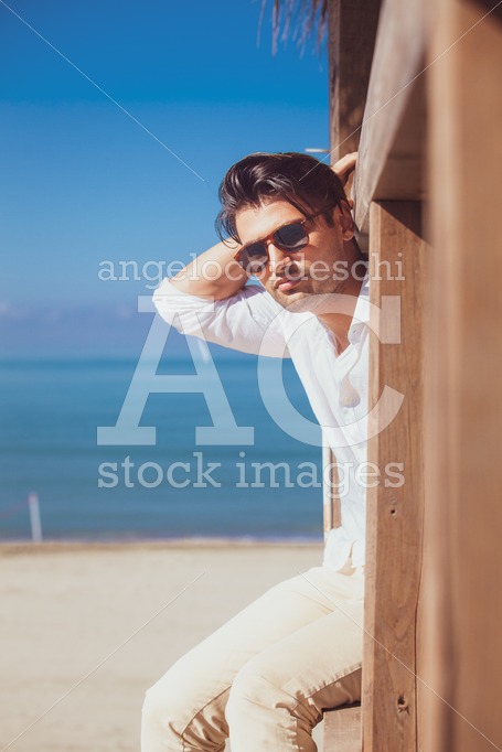 Man With White Shirt And Sunglasses On The Beach Vacation Lookin Angelo Cordeschi