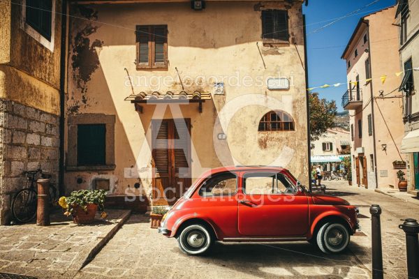 Old red vintage car italian scene in the historic center of smal - Angelo Cordeschi