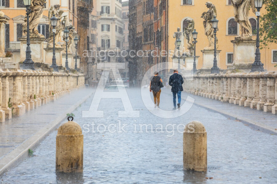 Rain In The Historic Center Of Rome In Italy. Two People Back To Angelo Cordeschi