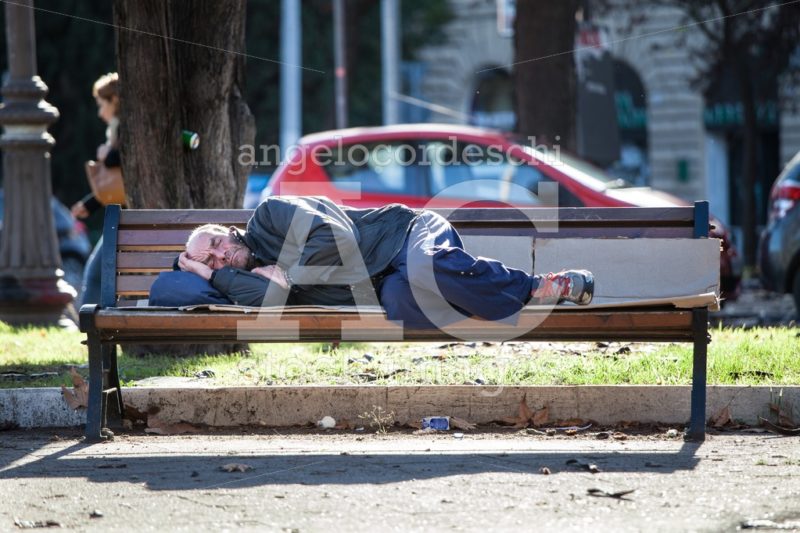 Rome, Italy. January 10, 2016: Homeless Man Sleeping On The Benc Angelo Cordeschi