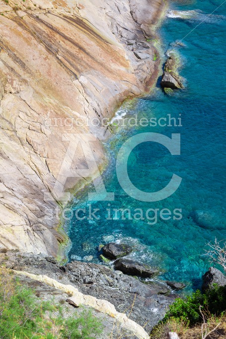 Seashore Coastline With Cliff And Rocks On A Mountain Slope. Blu Angelo Cordeschi