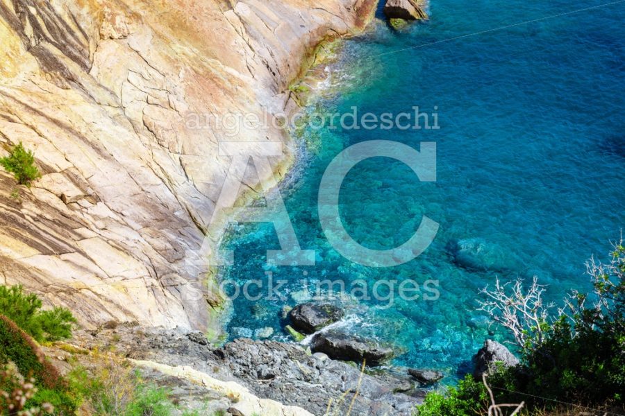 Seashore Coastline With Cliff And Rocks On A Mountain Slope. Blu Angelo Cordeschi