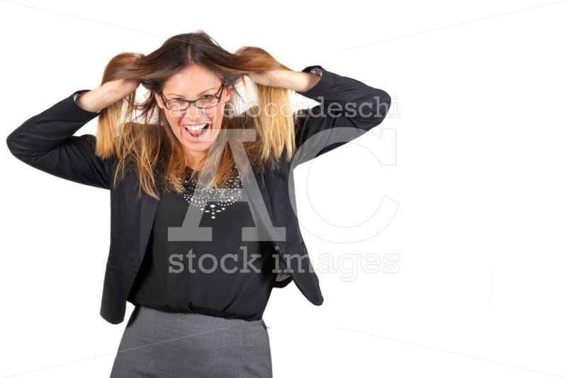 Stressed business woman pulling hair isolated on white. - Angelo Cordeschi