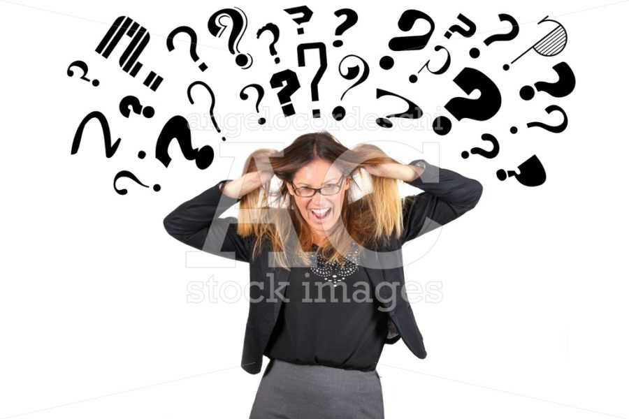 Stressed business woman question marks above head. Pulling hair. - Angelo Cordeschi