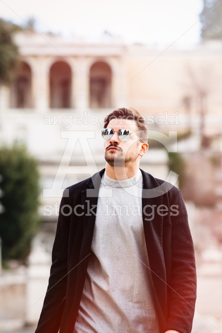 Stylish Man Walking With Sunglasses And Modern Hairstyle And Bea Angelo Cordeschi
