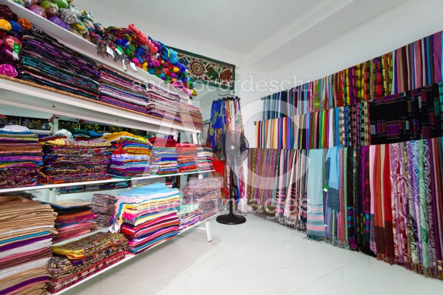 Textile Indian Sari Dress On Shelves In A Shop. Kandy, Sri Lanka Angelo Cordeschi