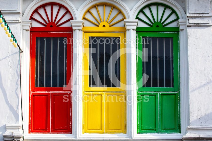 Three Colored Doors Or Windows Outside On The Facade Of An Ancie Angelo Cordeschi