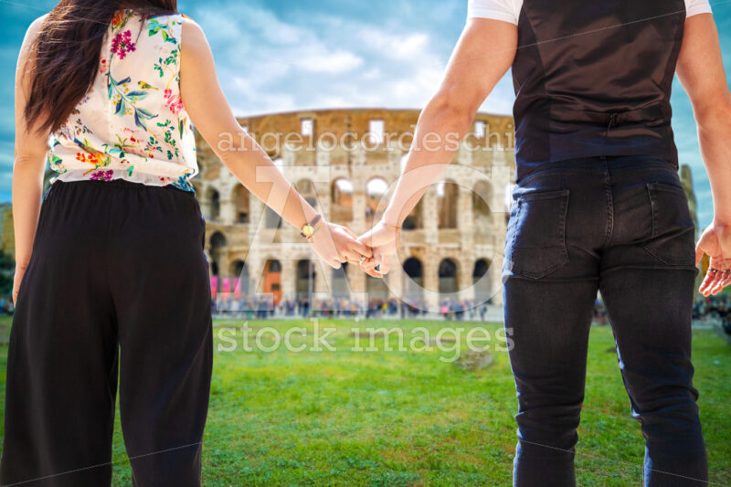 Travel In Italy Rome, Colosseum. Engaged Couple Tourists Walking Angelo Cordeschi