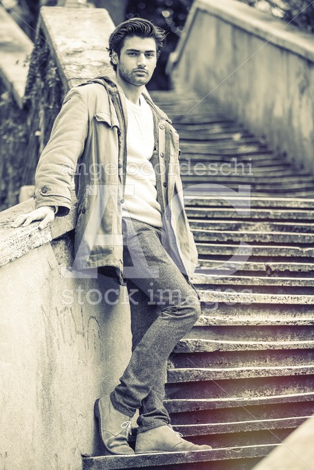 Trendy Young Man Posing Outdoor In The Street Leaning On A Wall Angelo Cordeschi