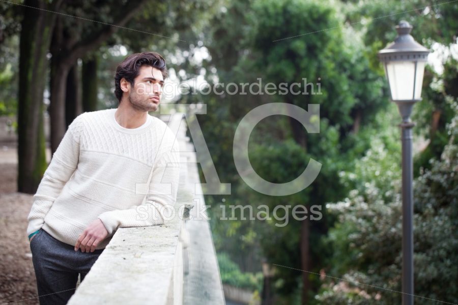 Trendy young man posing outdoor in the street overlooking and le - Angelo Cordeschi