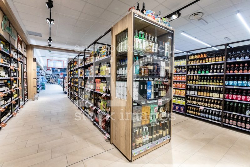 Wine Department With Bottles On Shelves Inside A Supermarket. Angelo Cordeschi