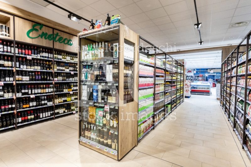 Wine Department With Bottles On Shelves Inside A Supermarket. Angelo Cordeschi